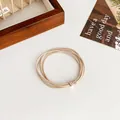 Creamy beige multi-layer elastic hair tie featuring a sparkling rose gold rhinestone buckle - Beige