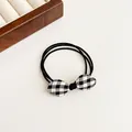 Elastic hair tie with a black and white checkered bow tie for women hairstyles - Black