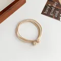 Beige multi-strand elastic hair ties with woven ball knots for high ponytail styling - Beige