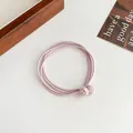 Light pink multi-strand elastic hair tie featuring delicate spherical decorative knots - Light Pink