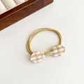 Elastic hair tie featuring cream plaid bow with multi-strand khaki rubber bands - Yellow