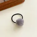 Elastic hair tie featuring a soft dark grey plush pom-pom for kids and girls - Gray