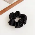 Elastic black scrunchie with silver polka dots and elegant ruffled fabric texture - Black