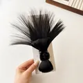 Messy bun claw clip extension in natural black fiber for voluminous high ponytail - Natural Black