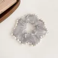 Elegant grey mesh scrunchie with white pearl trim for high-end ponytail hairstyles - Gray