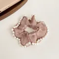 Elegant champagne organza scrunchie with white pearl trim for stylish ponytails - Purple Coffee