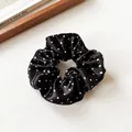 Haargummi aus Seidensatin in Schwarz mit weißen Punkten und hoher Elastizität - Schwarz