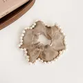 Elegant champagne organza scrunchie with white pearl trim and elastic band design - Brown