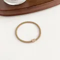 Coffee brown elastic hair tie with a minimalist heart-shaped charm accessory - Khaki