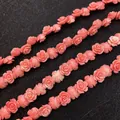 Macro shot of pink synthetic coral rose flower beads for DIY jewelry making and crafts - Camellia / 15mm (10 Pieces Pack)