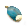 Macro detail of oval blue agate pendant with golden edging and a white shell charm - Blue Agate Style (No. 3) / 34x54mm