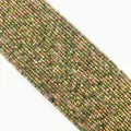 Macro shot of 2-3mm faceted Unakite stone beads for DIY jewelry making - Faceted Round Beads / Unakite