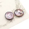 Macro detail of iridescent purple baroque freshwater button pearls with metallic luster - 19-20mm / Purple (Undrilled)