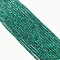 Macro view of faceted natural malachite beads showing green stripes for DIY jewelry - Faceted Round Beads / Malachite