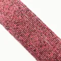 Close-up of pink faceted natural stone beads for DIY jewelry making and necklace crafts - Faceted Round Beads / Rhodochrosite