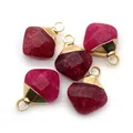 Close-up of five faceted magenta gemstone pendants with gold caps for DIY jewelry - 12x15mm / Rose Red Chalcedony