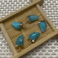 Five pieces of horn-shaped natural stone pendants in lake blue with golden metal caps - Light Blue Chalcedony