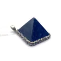 Macro view of pyramid lapis lazuli pendant with silver metal rim and crystal accents - Lapis Lazuli