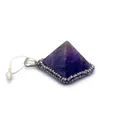 Macro shot of pyramid amethyst pendant with sparkling rhinestone details and silver clasp - Purple Crystal