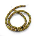 Détail macro de perles en pierre impériale jaune en forme d'abaque pour bijoux DIY - US 5