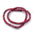 Close-up of red imperial jasper tube beads with natural patterns for DIY jewelry making - Red