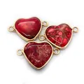 Macro shot of heart-shaped red imperial stone pendants with gold-plated bezel and dual loops - No.1 (Red Texture)