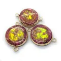 Detailed macro view of three round natural imperial jasper stone jewelry connectors with gold rims - Purple-Red Yellow-Green Mottled (Style 2)