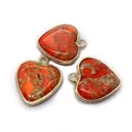 Three heart-shaped red imperial stone pendants with gold-plated edges on white background - Red Orange Cracked Style