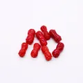 Macro view of eight red synthetic coral beads with rose floral carvings for jewelry making - Double-Head Rose Style