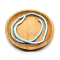 Flat round light blue natural shell heishi beads for DIY jewelry making in a wood tray - Light Blue