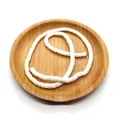White flat round natural shell heishi beads for DIY jewelry making on a wooden tray - White
