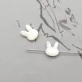 Macro detail of rabbit-shaped natural shell beads with drill holes for DIY jewelry - Horizontal Hole Rabbit Head / White