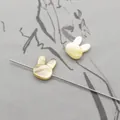 Detailed view of rabbit-shaped natural shell beads with drill holes for DIY jewelry - Horizontal Hole Rabbit Head / Yellow