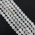 Macro shot of white shell flower beads with natural iridescent luster for DIY jewelry - Plum Flower / Small Size