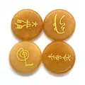 Macro detail of four yellow quartz Reiki stones with golden engraved healing symbols - 4 Pieces/Pack (25x6mm) / Topaz