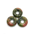 Three natural ruby zoisite donut pendants with pink and green mineral patterns - Unakite