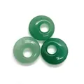 Three pieces of natural green aventurine donut beads with polished mineral texture - Green Aventurine
