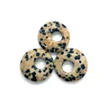 Three Dalmatian Jasper gemstone donut pendants with natural black spots on beige base - Dalmatian Jasper