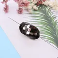 Detailed view of oval mosaic abalone shell bead with iridescent checkerboard pattern - 14x28mm / No.4 (Iridescent Black)