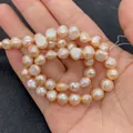 Strand of natural freshwater baroque pearls in peach pink for DIY jewelry making - 4-5mm / Orange Pink (2)