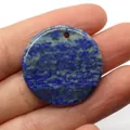 Polished round Lapis Lazuli stone pendant with natural blue and gold mineral textures - Lapis Lazuli