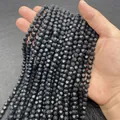Polished black faceted stone beads for DIY jewelry making held in hand for scale - Small / Black Stone
