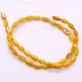 Macro-opname van gele ovale rijstschelpkralen voor DIY sieraden maken accessoires - 5x8-6x9mm / Geel (Nr.8)
