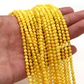 Dettaglio di perline rotonde in conchiglia naturale gialla per creazione di gioielli - Medio (3mm) / Giallo (n.7)