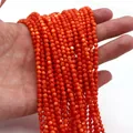 Primo piano di perle tonde in conchiglia naturale arancione-rosso per gioielli fai da te - Medio (3mm) / Rosso Arancio (N. 6)