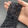 Perline di agata nera sfaccettata per creazione gioielli fai da te in mano - Agata nera