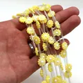 Close-up of yellow daisy shell beads and transparent tubes for DIY jewelry making - 6mm / No. 2 (Yellow)