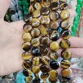 Hand-held round flat tiger eye stone disc beads with natural brown and yellow silk luster - 16x16x6mm / Tiger's Eye