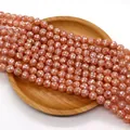 Macro di perle a mosaico in conchiglia arancio-rosa su un vassoio di legno naturale - 10mm / Rosa Corallo