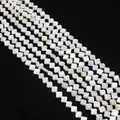 Macro view of natural white clover-shaped mother of pearl shell beads for jewelry - Four-Petal Flower / 6mm